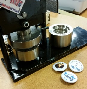 Tufts button maker and buttons.