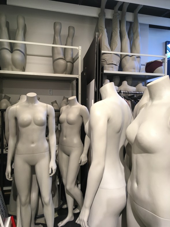 View of women's mannequins in storage.